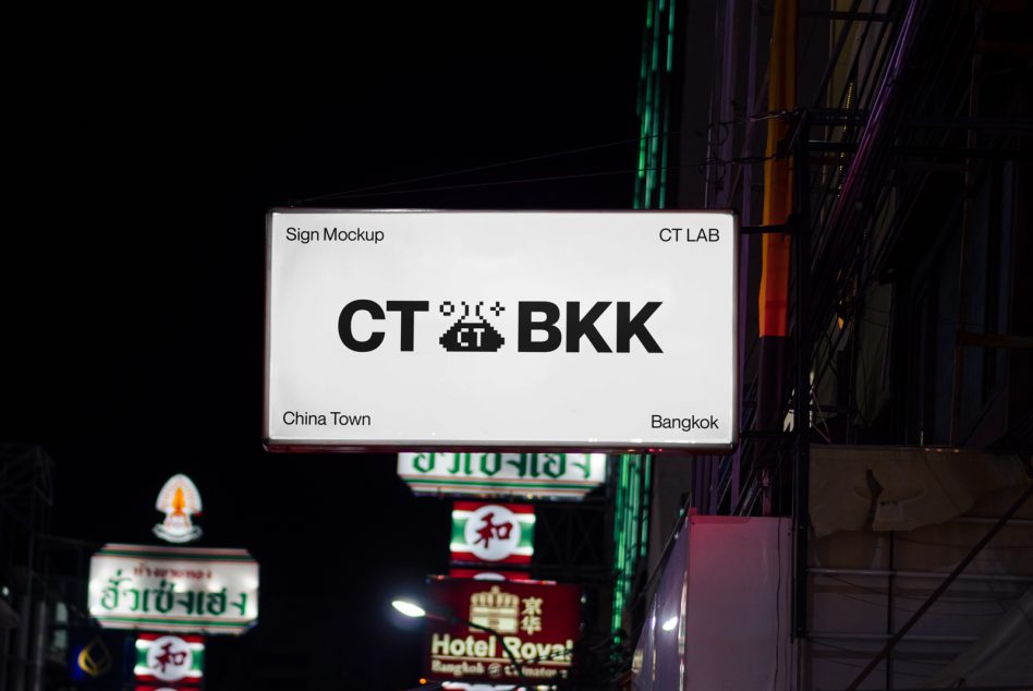 Illuminated street sign mockup displaying CT LAB BKK text at night, with urban background for graphic design and advertising.